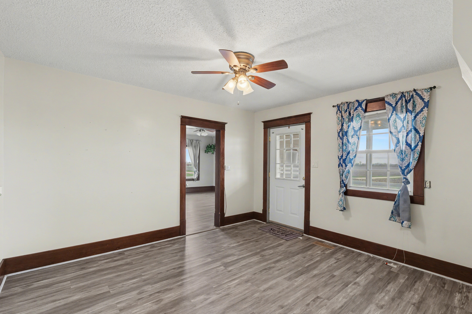 724 East 2600 North Road Penfield, IL 61862 - Photo 8 of 43 wooden floor in an empty room with a window