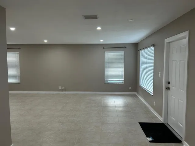 an empty room with windows