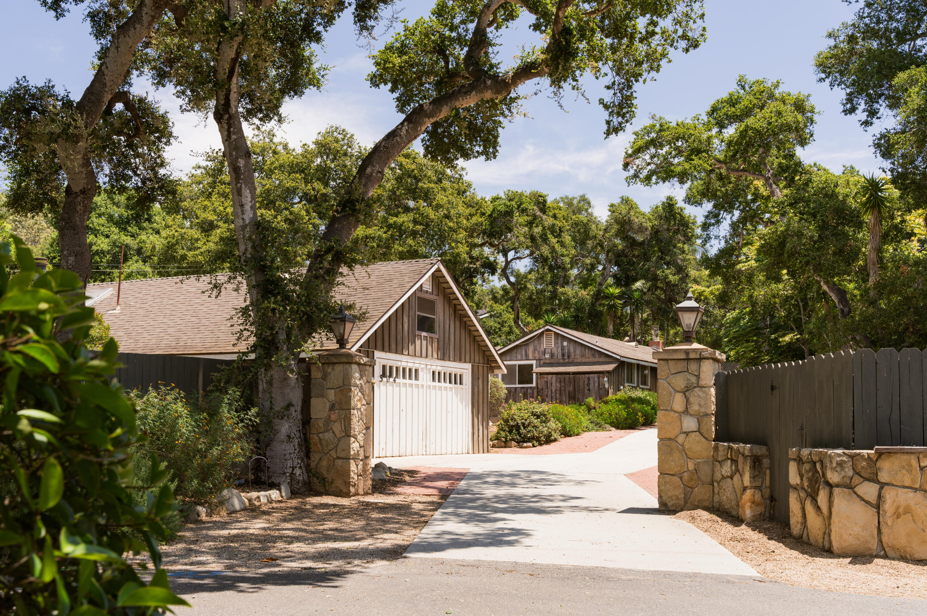 504 Hodges Lane Montecito, CA 93108 - Photo 14 of 14 a front view of a house with a yard and tree s