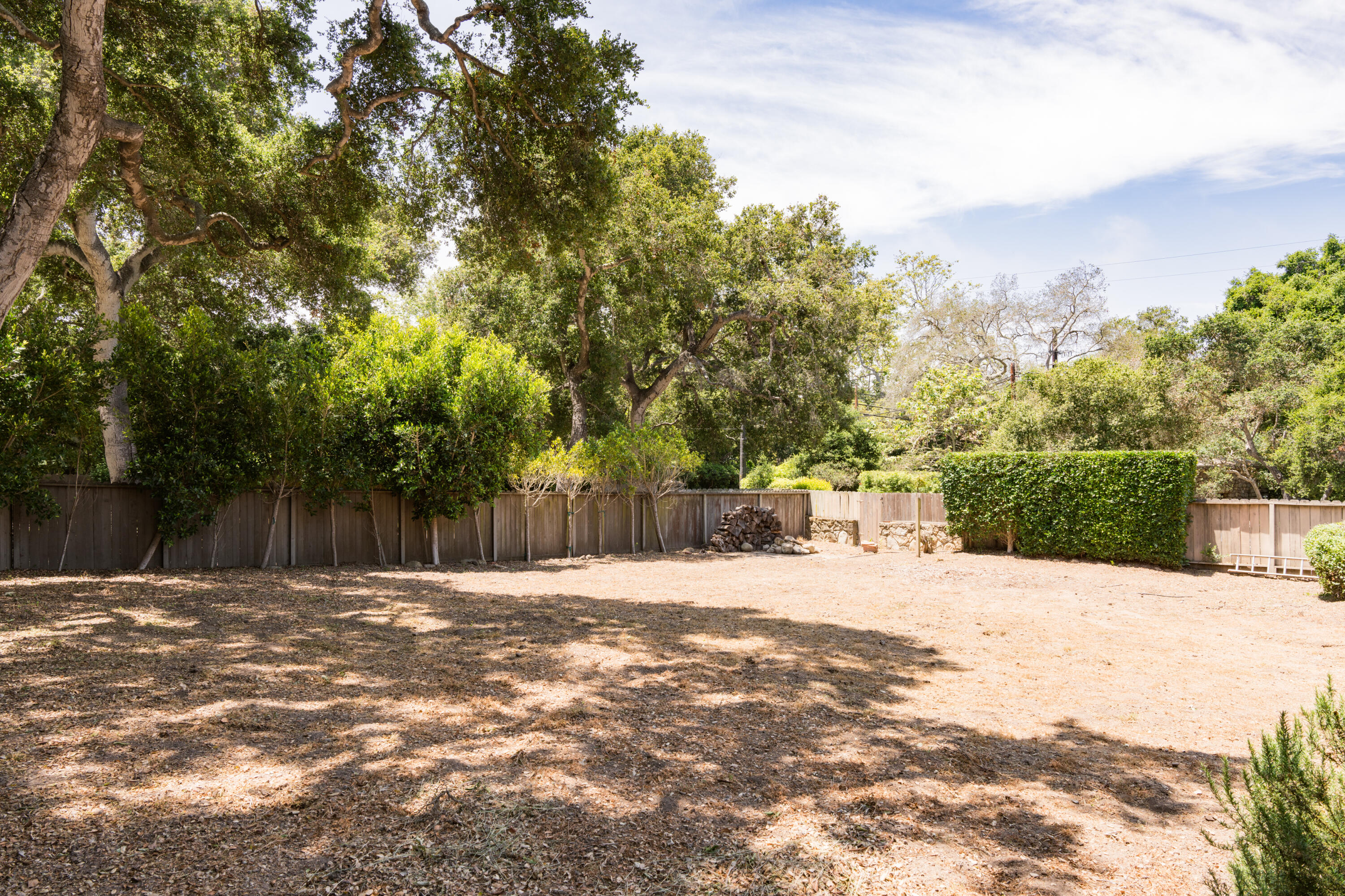 504 Hodges Lane Montecito, CA 93108 - Photo 4 of 14 a street view with wooden fence