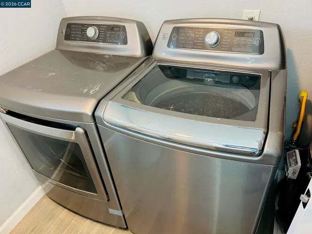 a kitchen with stainless steel appliances a refrigerator and a stove top oven