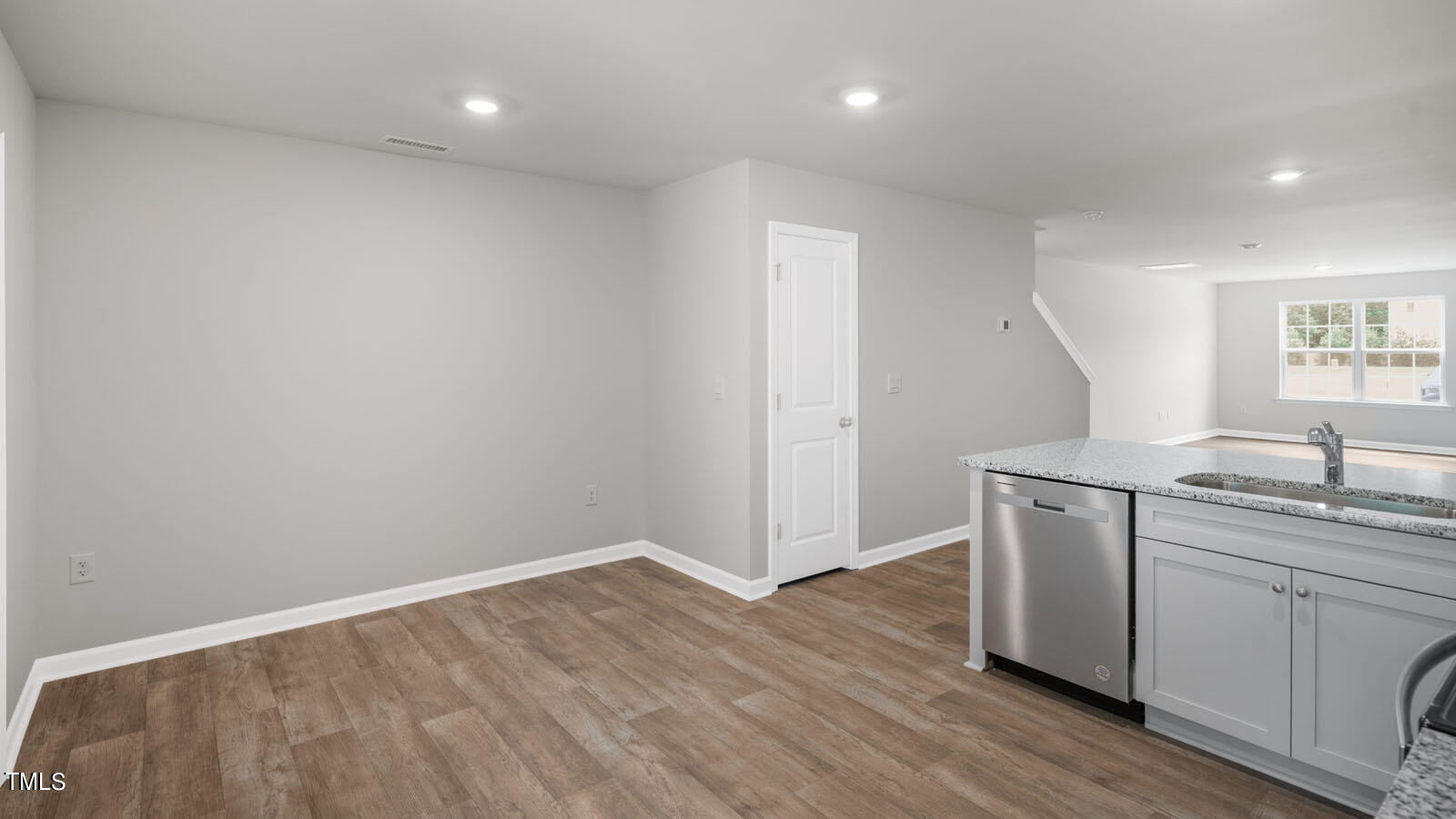 8741 Asher Gray Way Raleigh, NC 27616 - Photo 29 of 49 a kitchen with a sink and wooden floor