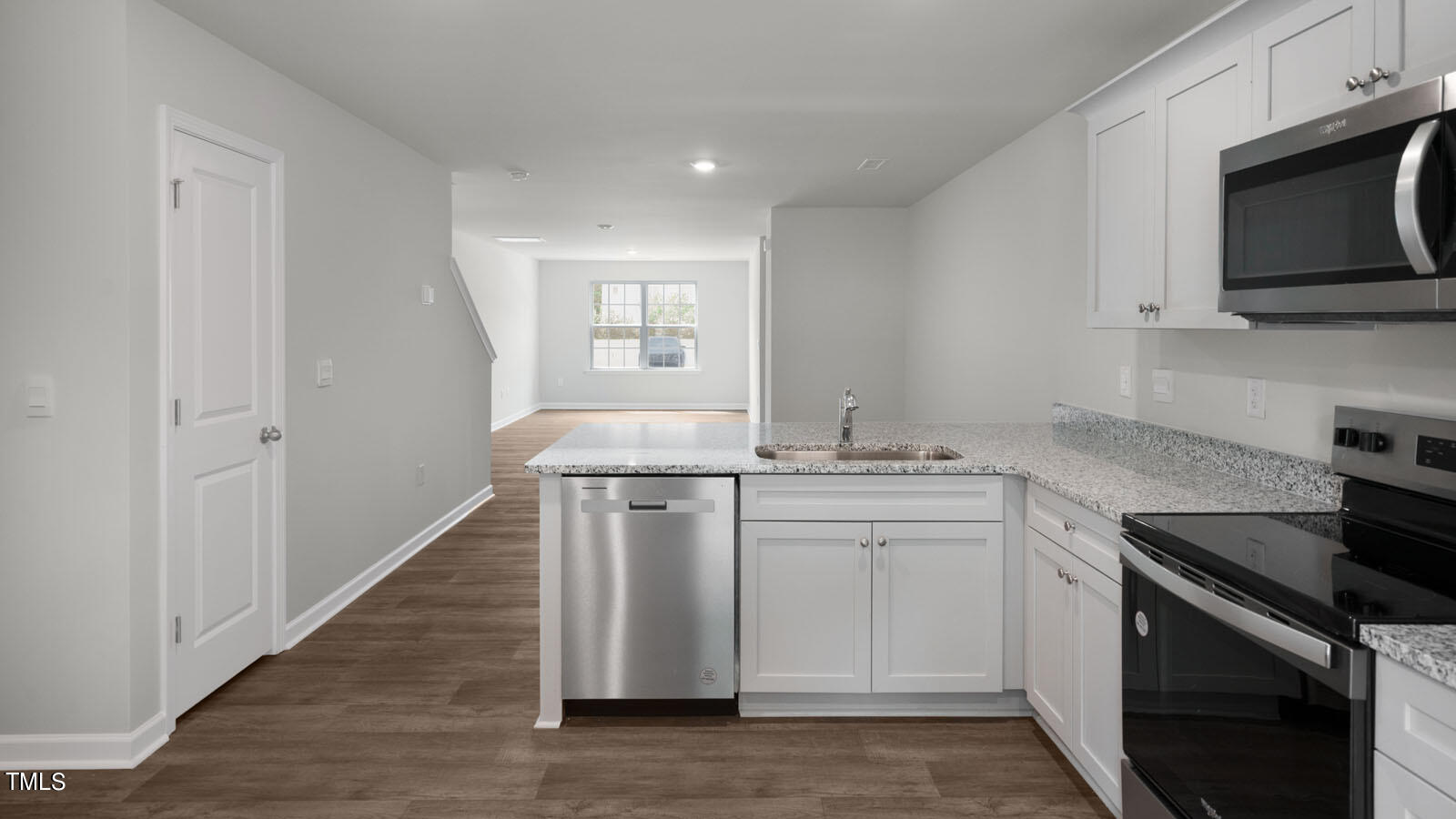 8741 Asher Gray Way Raleigh, NC 27616 - Photo 30 of 49 a kitchen with stainless steel appliances granite countertop a sink stove and microwave