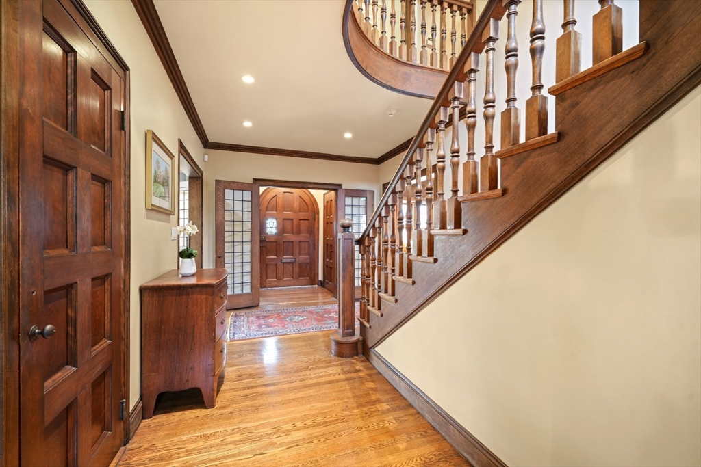 91 Hundreds Road Wellesley, MA 02481 - Photo 3 of 42 a view of entryway and hall with wooden floor
