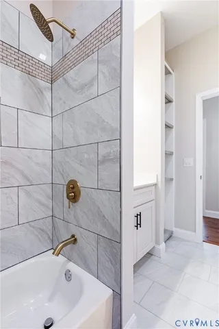 a bathroom with a sink and shower