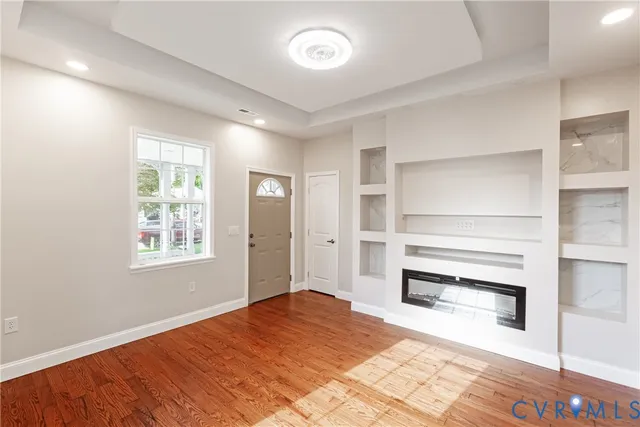 a bedroom with a bed and a ceiling fan