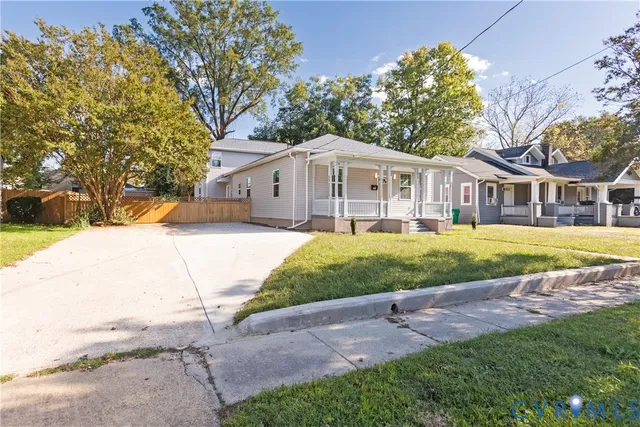 a view of a backyard with a sitting area