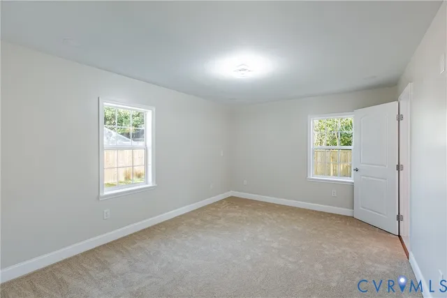 an empty room with windows