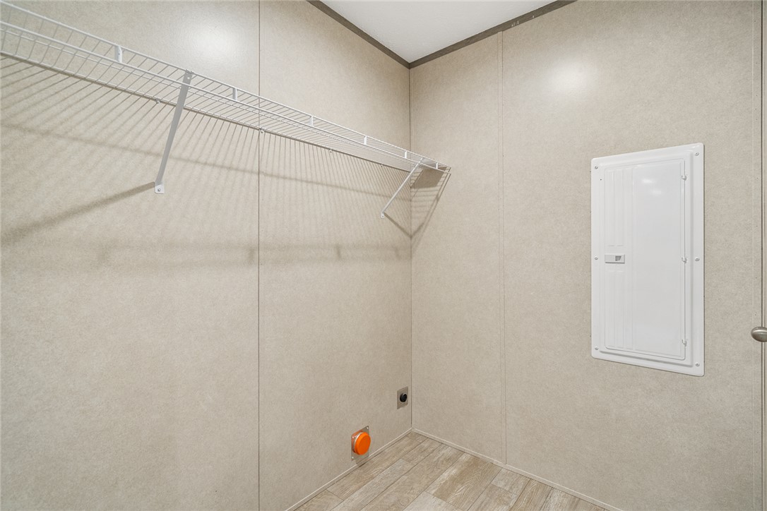 419 Austin Drive Anderson, SC 29624 - Photo 29 of 36 This laundry area features convenient hookups and a practical wire shelf for storage.