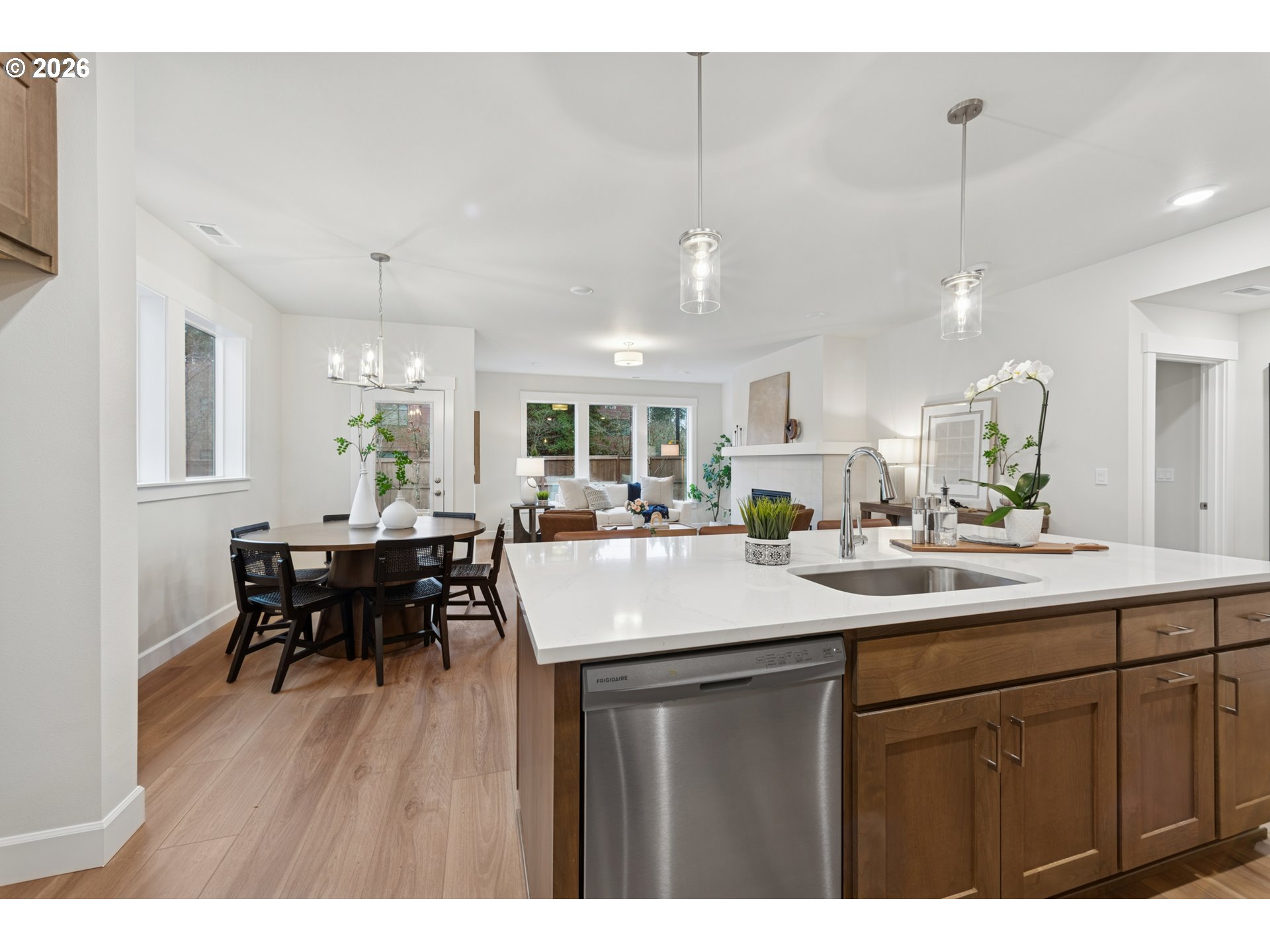 16546 Southwest Deer Terrace Durham, OR 97224 - Photo 14 of 26 a dining hall with stainless steel appliances kitchen island a table and chairs