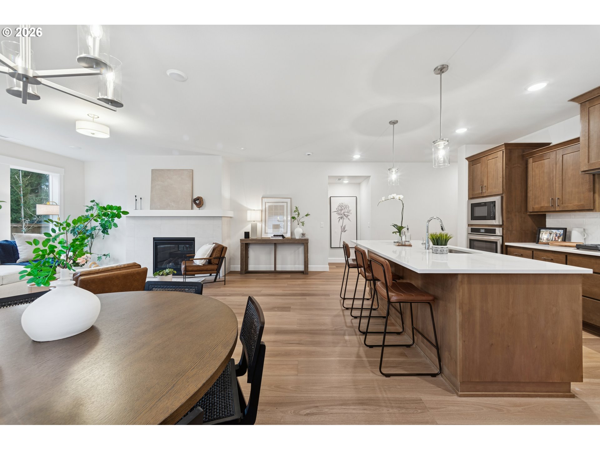 16546 Southwest Deer Terrace Durham, OR 97224 - Photo 16 of 26 a living room with furniture a fireplace and a potted plant