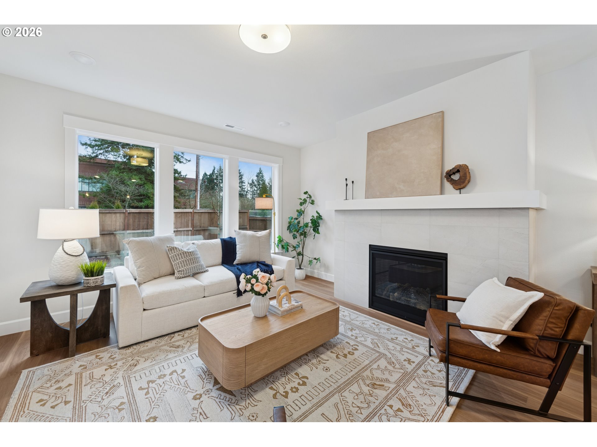 16546 Southwest Deer Terrace Durham, OR 97224 - Photo 17 of 26 a living room with furniture and a fireplace