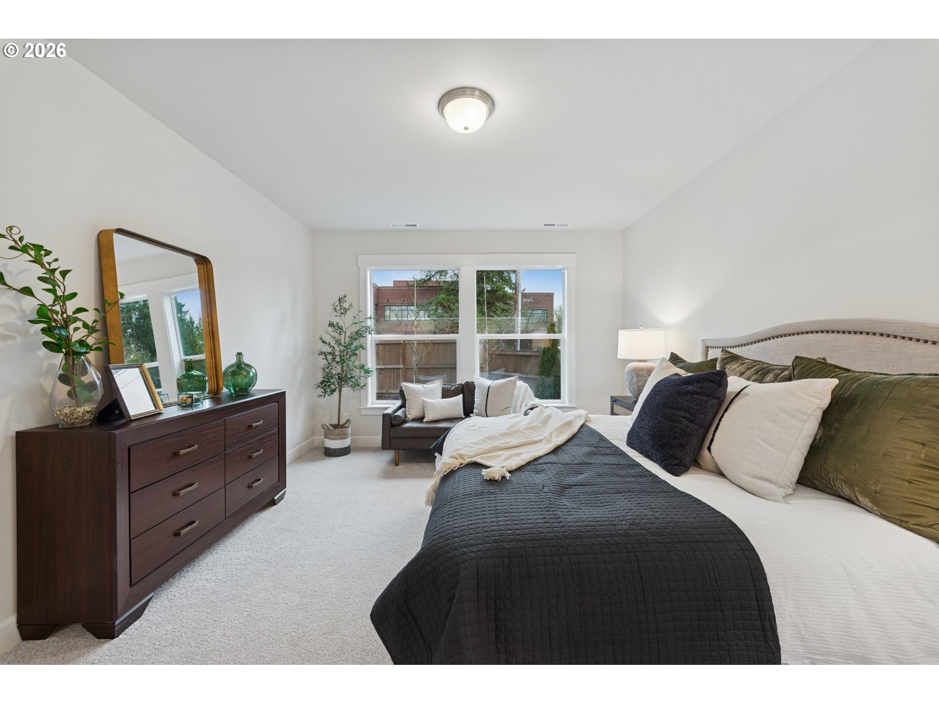 16546 Southwest Deer Terrace Durham, OR 97224 - Photo 20 of 26 a bedroom with a bed and window with dresser
