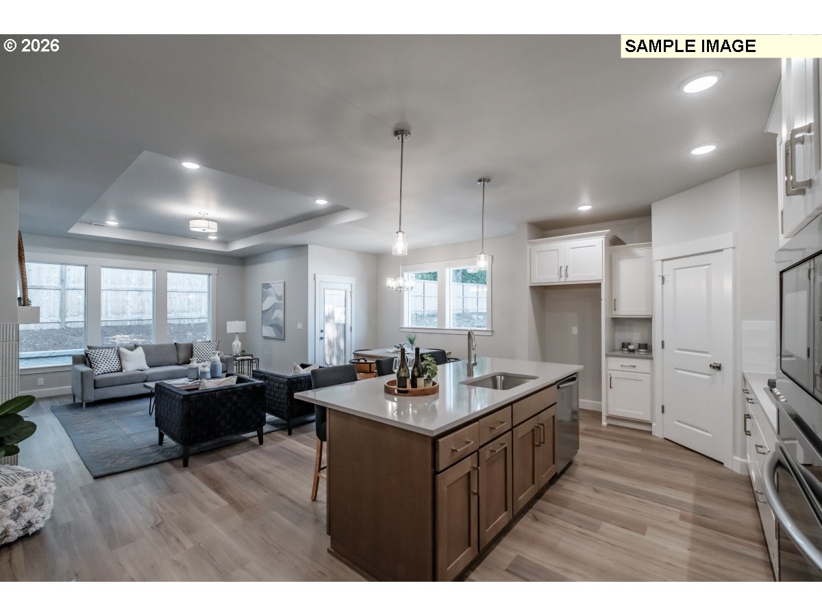16546 Southwest Deer Terrace Durham, OR 97224 - Photo 2 of 26 a kitchen with counter top space sink stove and refrigerator