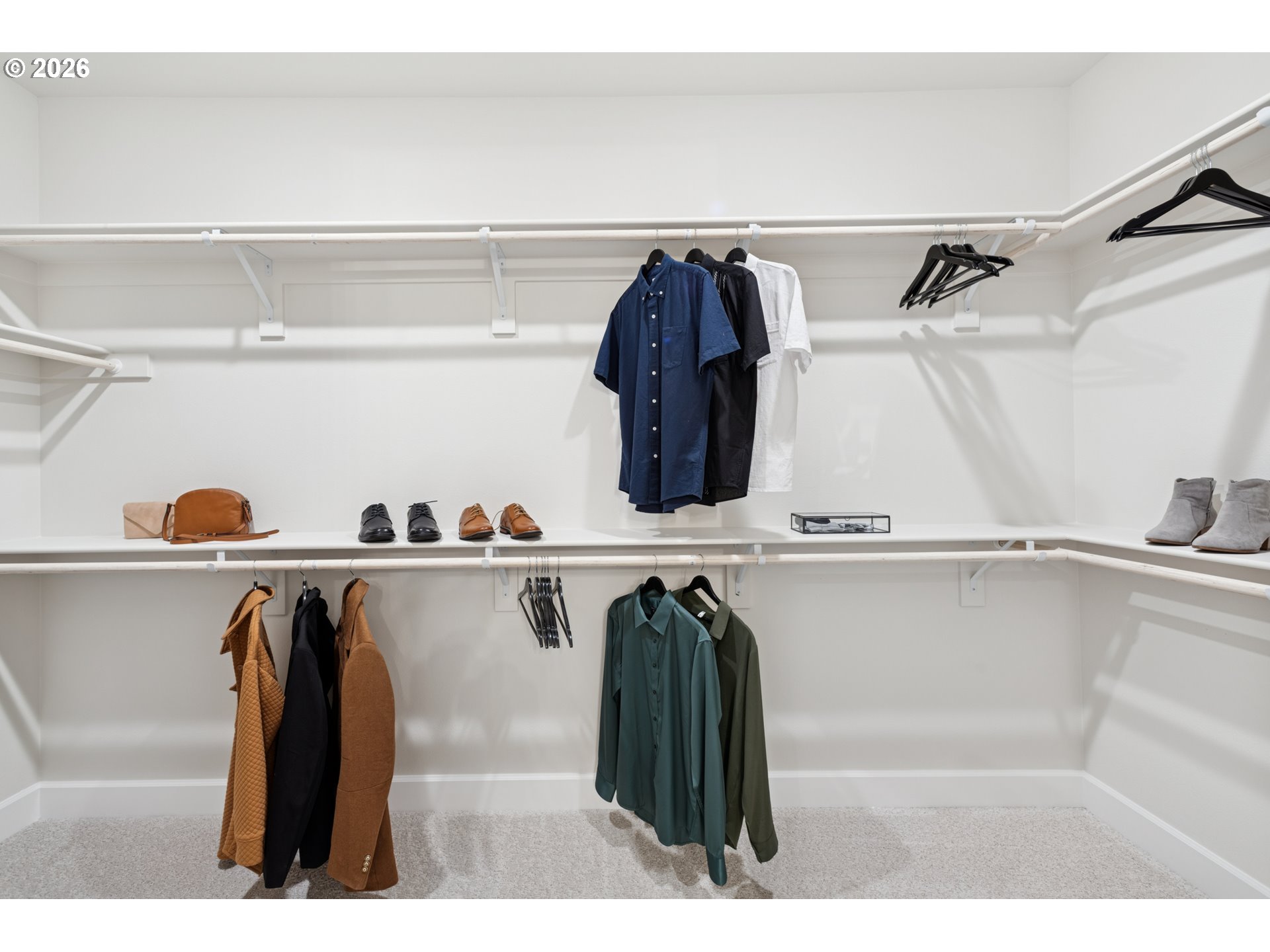 16546 Southwest Deer Terrace Durham, OR 97224 - Photo 23 of 26 a view of walk in closet with clothes and shoes