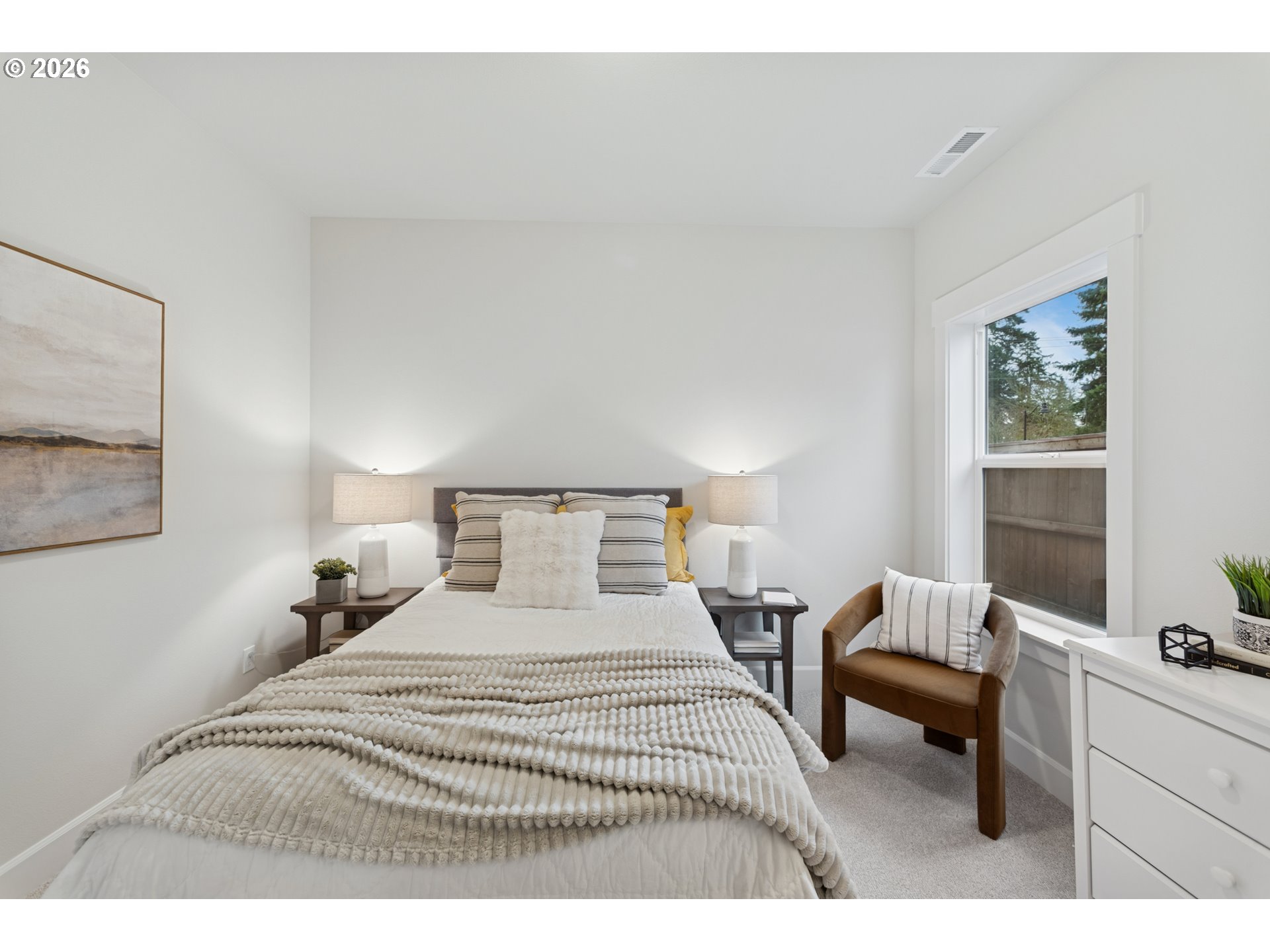 16546 Southwest Deer Terrace Durham, OR 97224 - Photo 7 of 26 a bedroom with a bed a table and chair