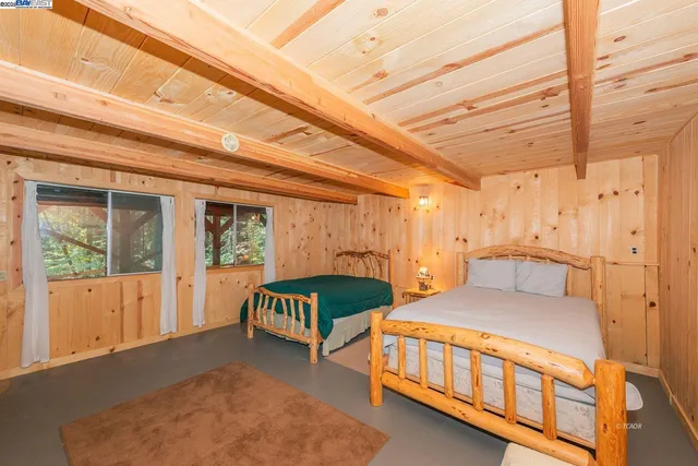 a bedroom with furniture and a window