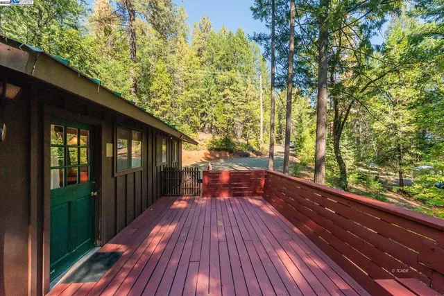 a view of balcony with wooden floor