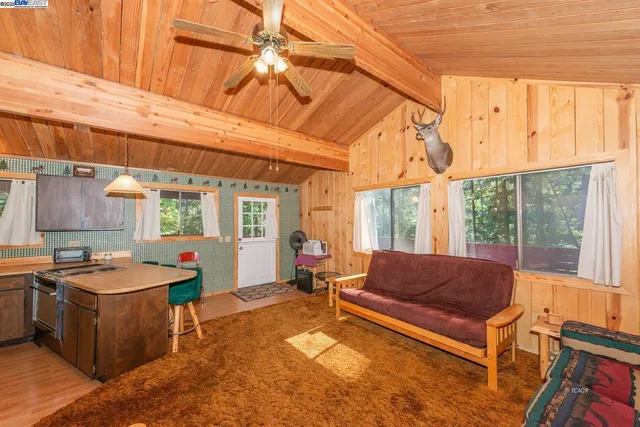 a living room with patio furniture and a window