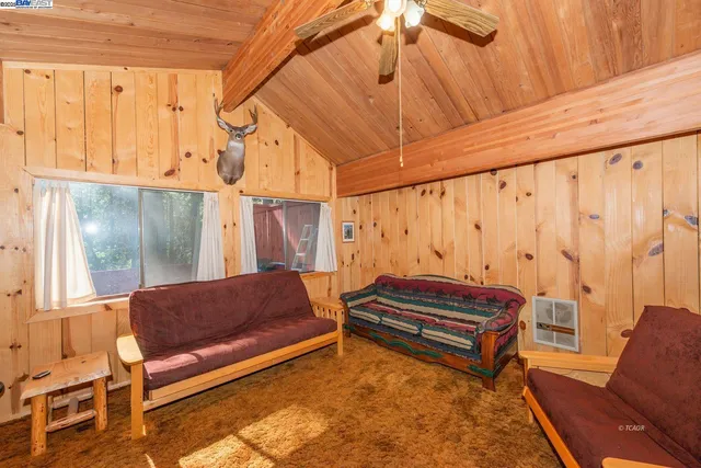 a outdoor living area with a couch and a table