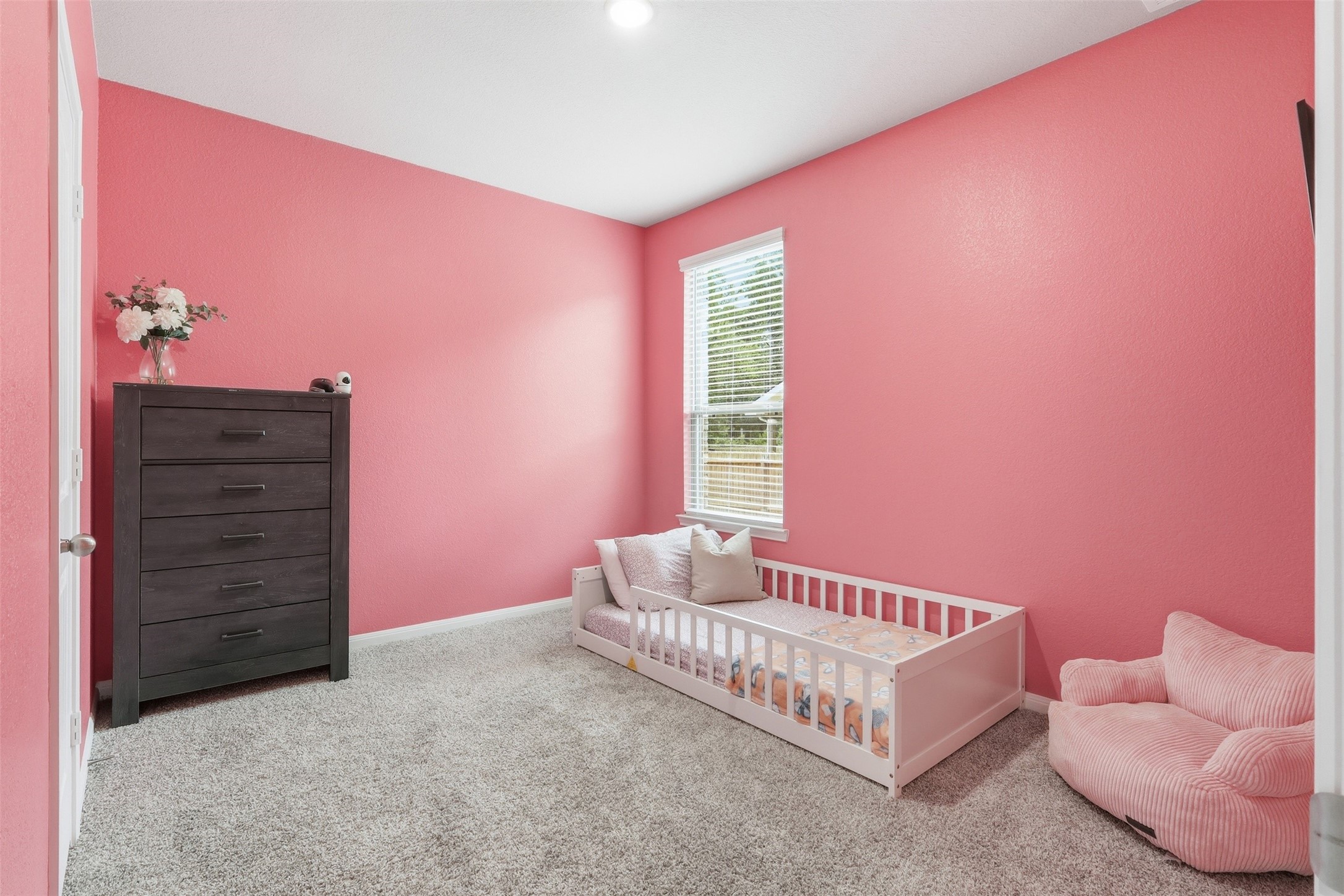 6310 Fawn Path Drive Conroe, TX 77303 - Photo 20 of 41 Spacious first-floor secondary bedroom conveniently located next to a full bathroom, ideal for guests or multigenerational living.