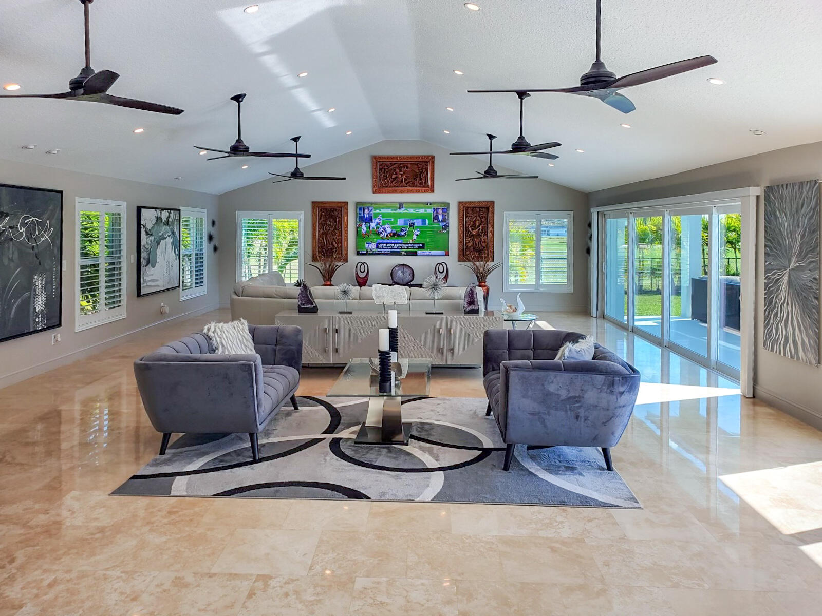 4 Country Club Road Cocoa Beach, FL 32931 - Photo 13 of 38 a living room with furniture a chandelier and a large window