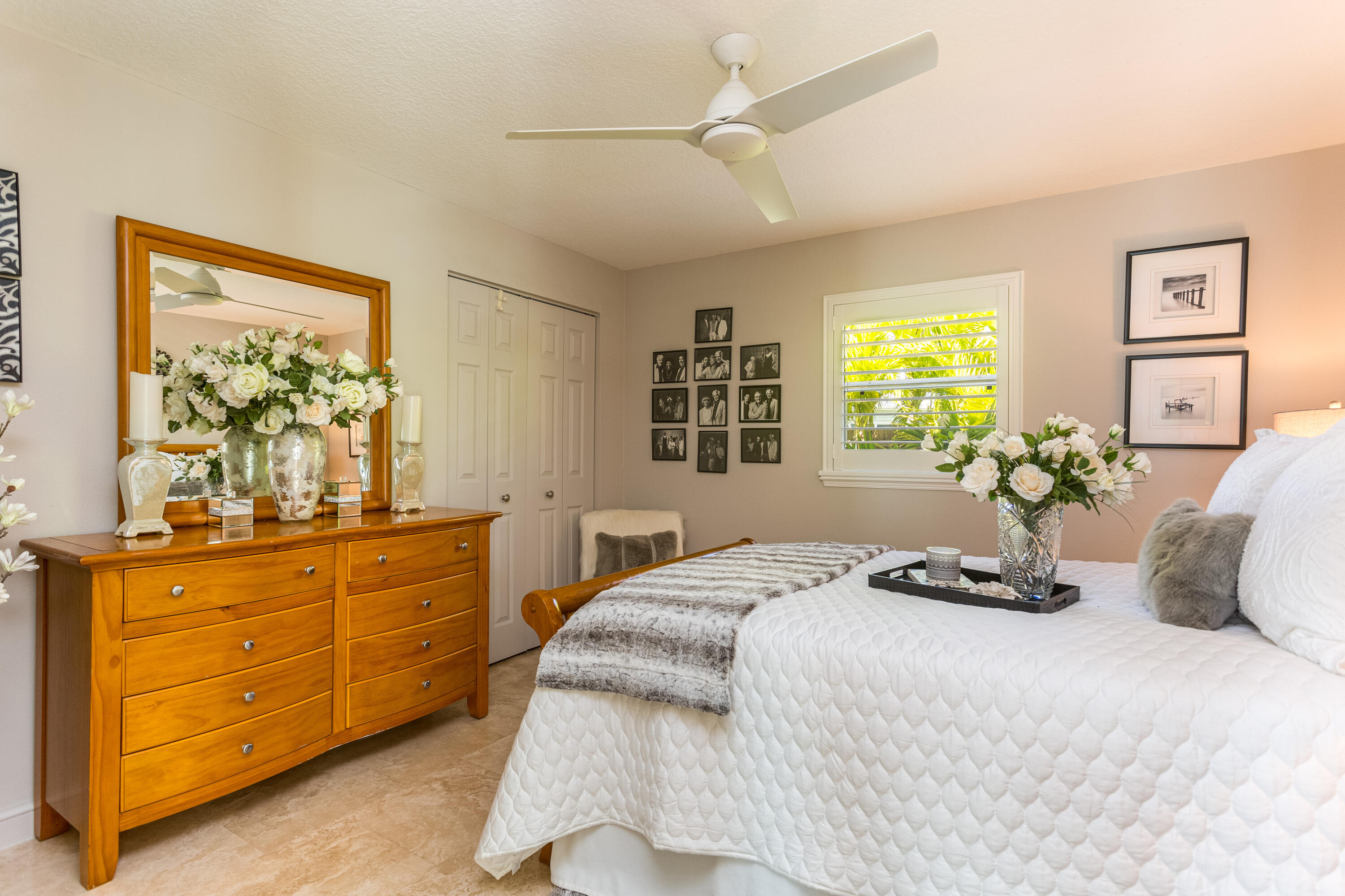 4 Country Club Road Cocoa Beach, FL 32931 - Photo 22 of 38 a bedroom with a bed and a dresser