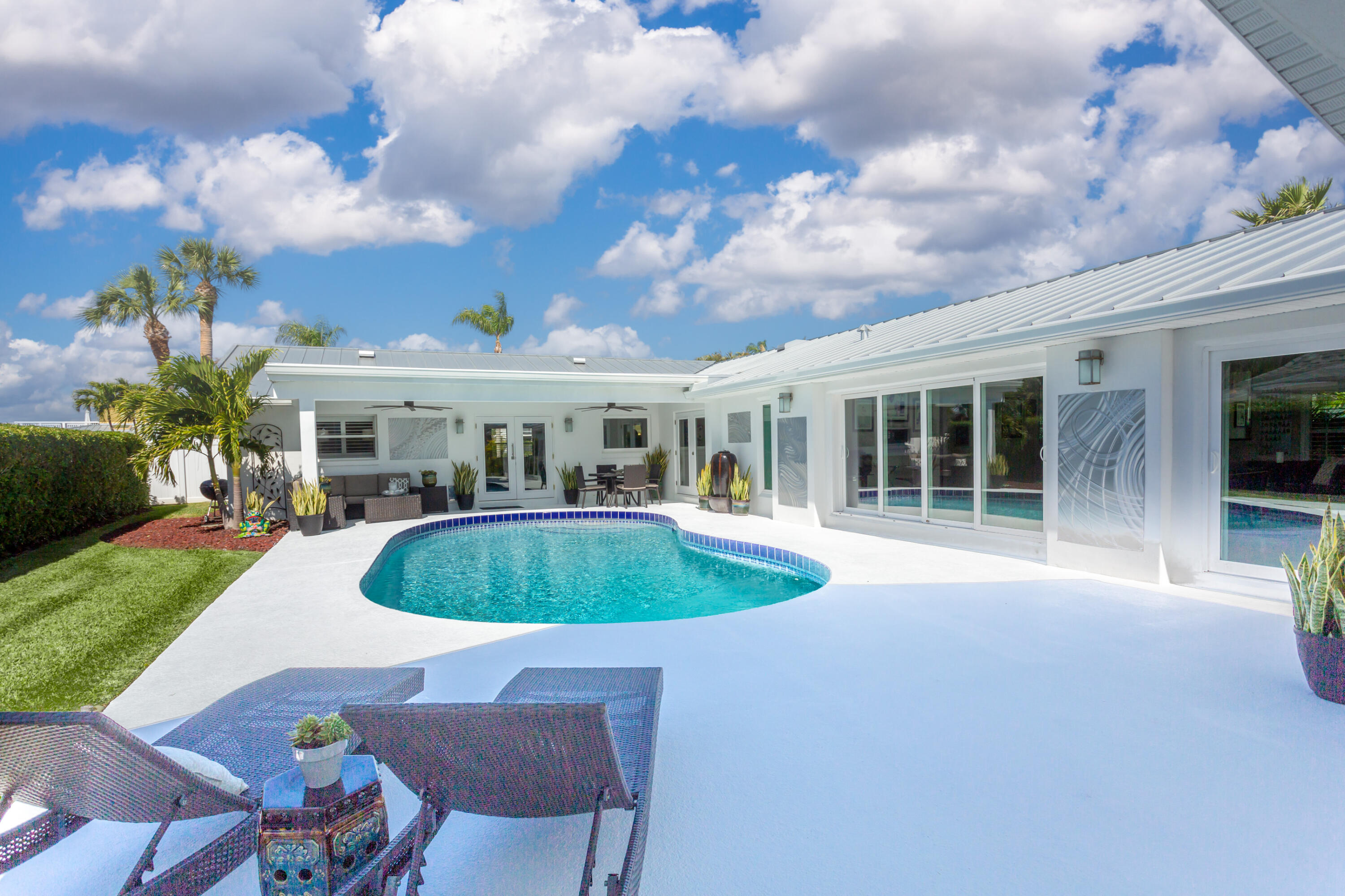 4 Country Club Road Cocoa Beach, FL 32931 - Photo 24 of 38 a front view of house with outdoor space and garden