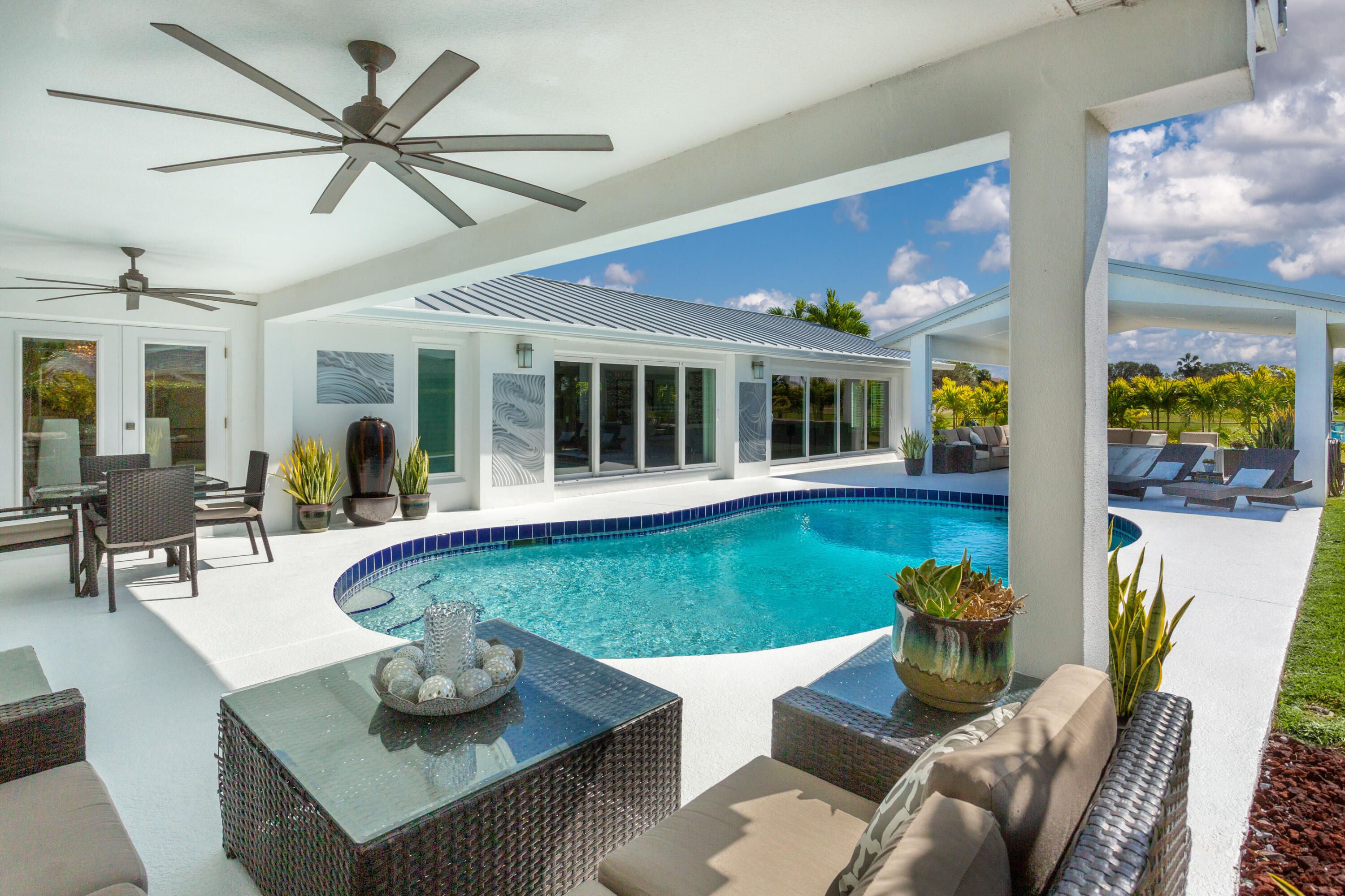 4 Country Club Road Cocoa Beach, FL 32931 - Photo 25 of 38 a living room with furniture and a window