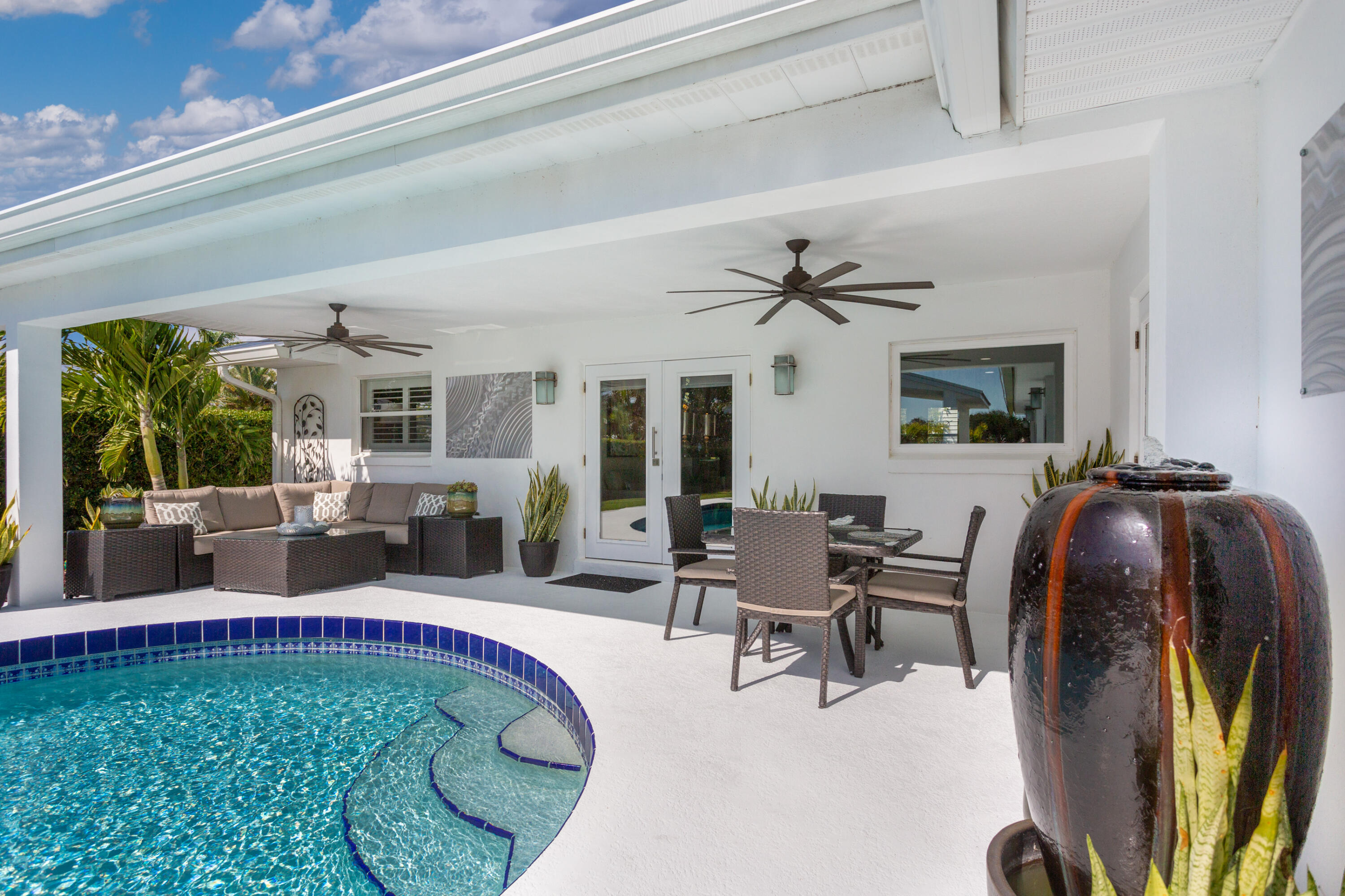 4 Country Club Road Cocoa Beach, FL 32931 - Photo 26 of 38 a living room with furniture and a large window