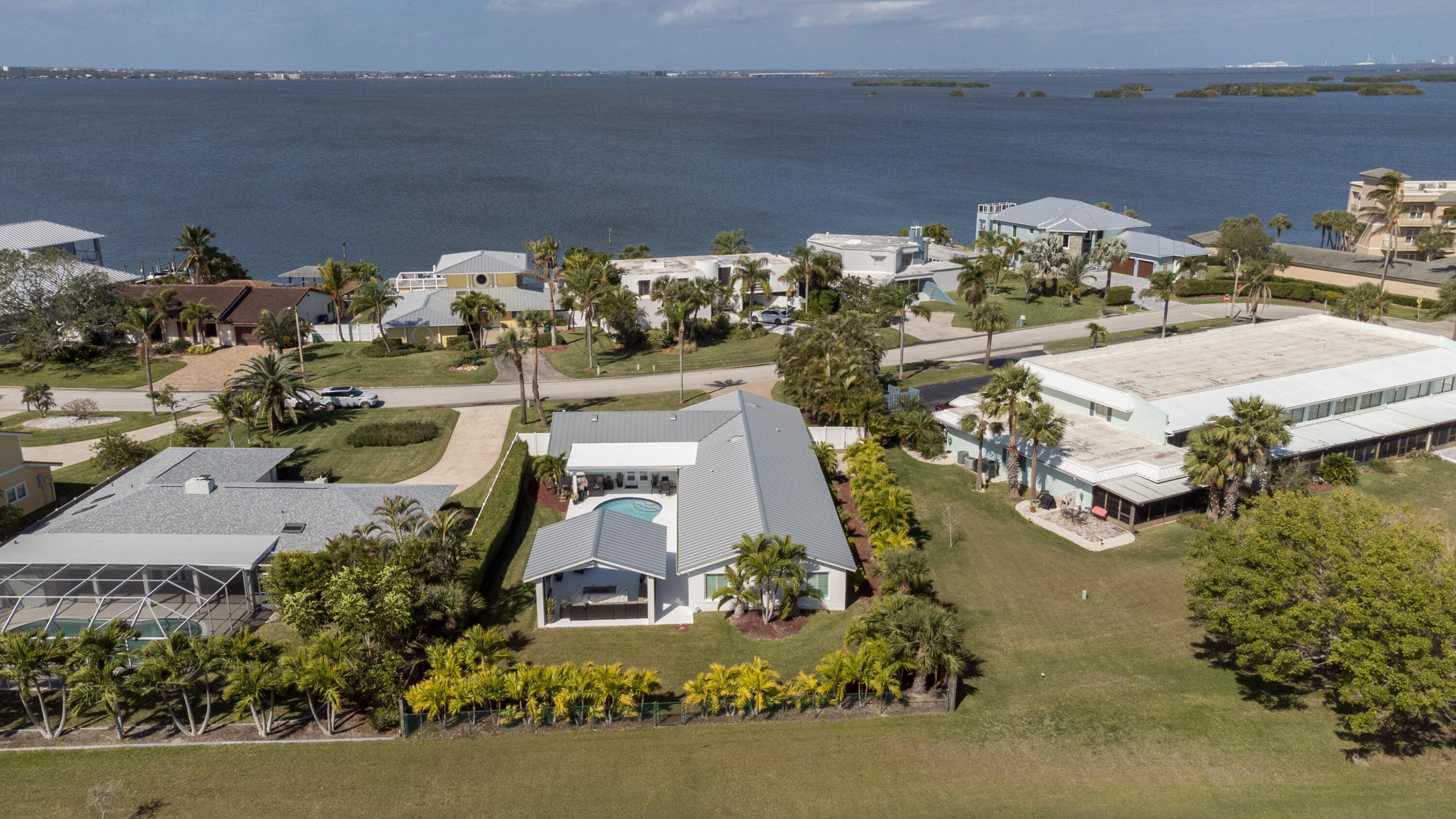 4 Country Club Road Cocoa Beach, FL 32931 - Photo 36 of 38 aerial view of a house with a lake view