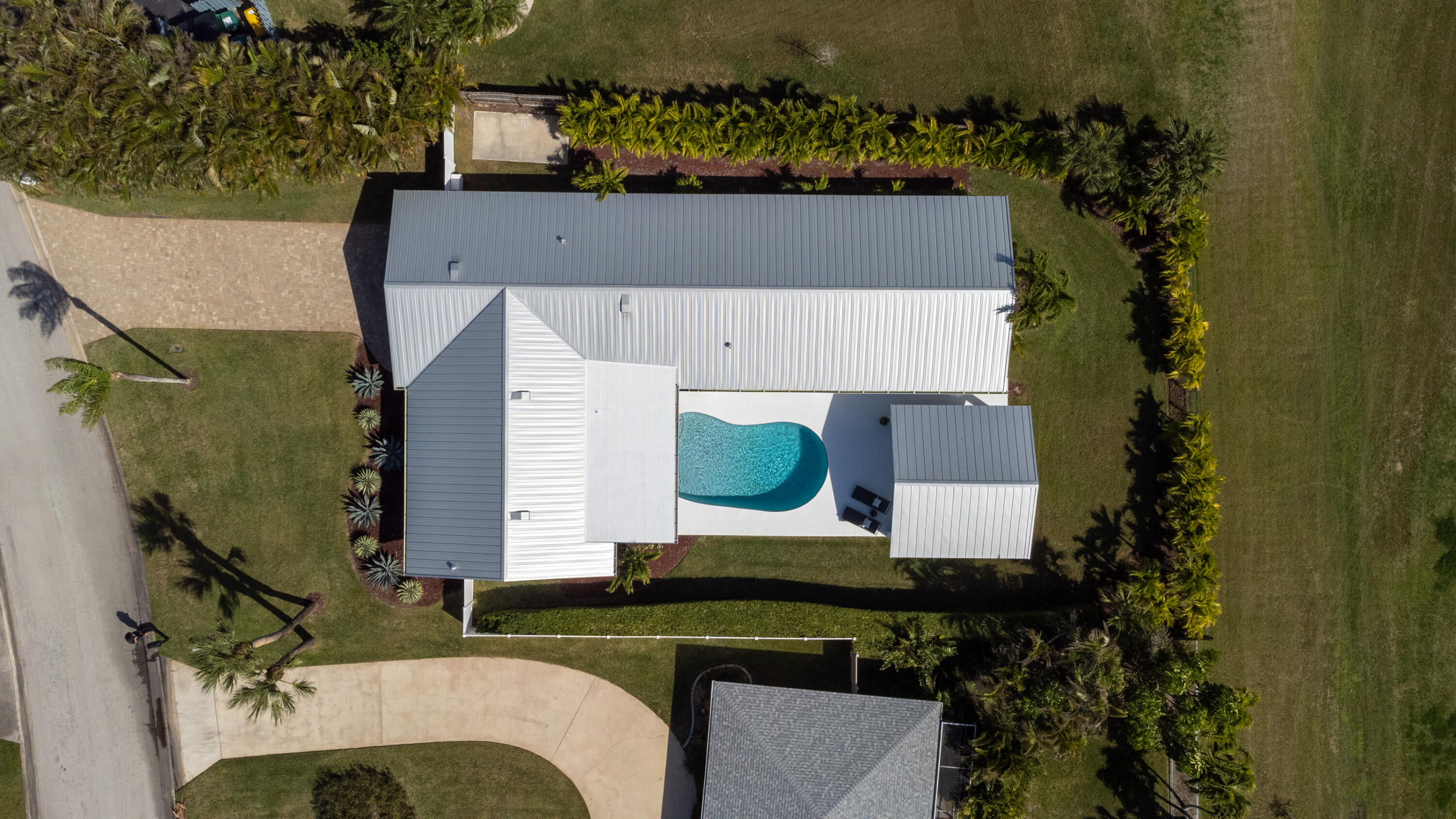 4 Country Club Road Cocoa Beach, FL 32931 - Photo 37 of 38 an aerial view of a house with a yard