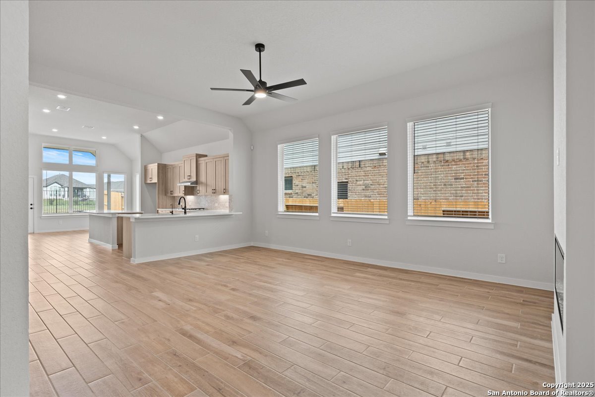 2122 Shepards Street Seguin, TX 78155 - Photo 13 of 28 a view of an empty room with window and wooden floor
