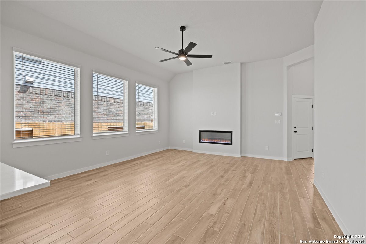 2122 Shepards Street Seguin, TX 78155 - Photo 16 of 28 an empty room with windows and fan