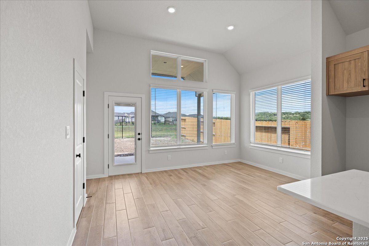 2122 Shepards Street Seguin, TX 78155 - Photo 18 of 28 a view of an empty room with a window and wooden floor