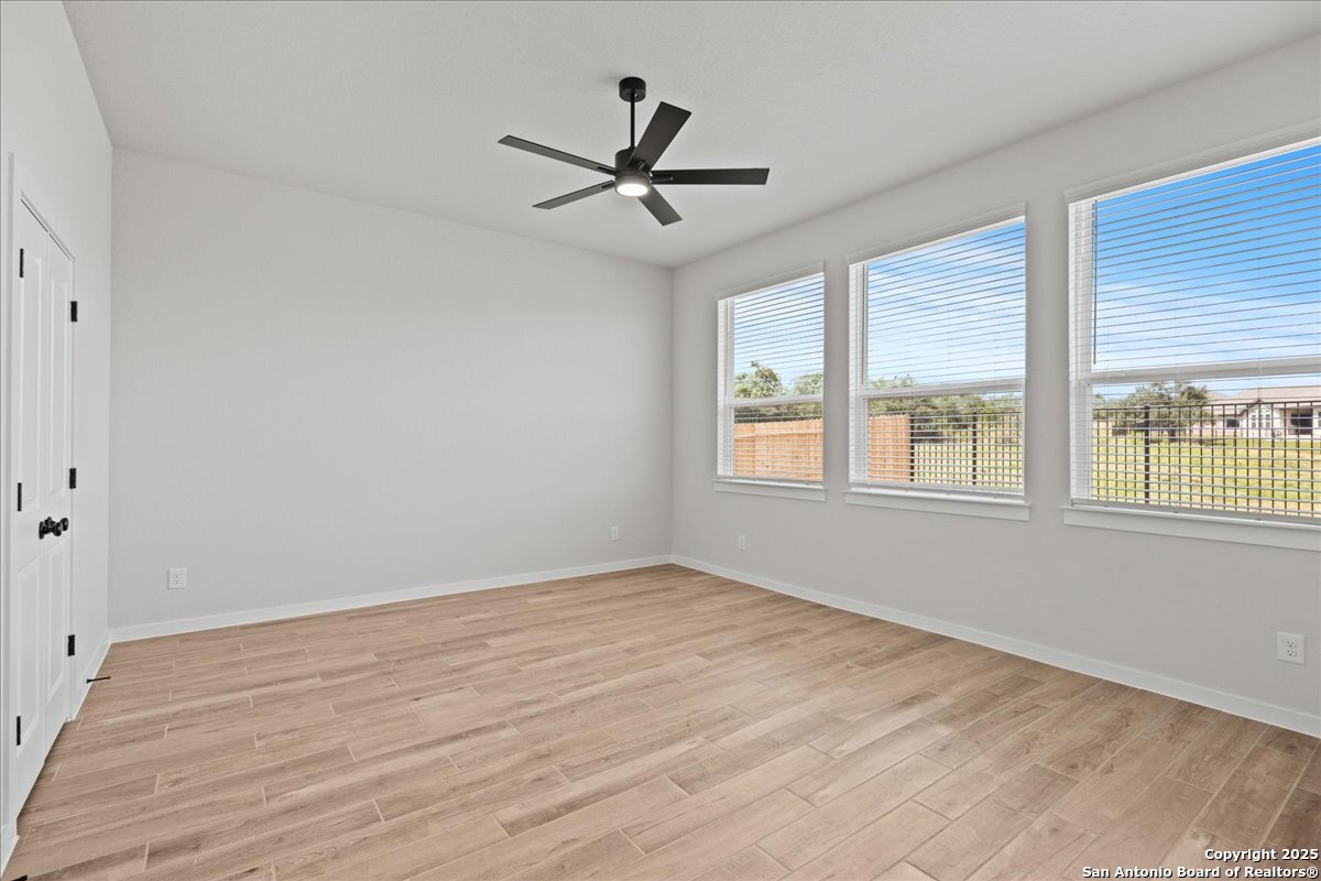 2122 Shepards Street Seguin, TX 78155 - Photo 19 of 28 a view of empty room with wooden floor and fan