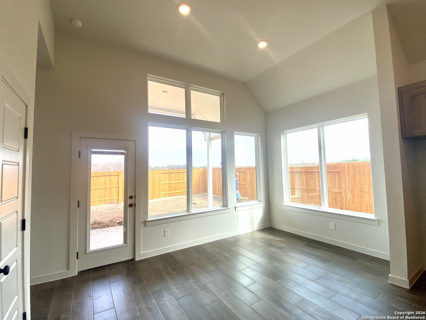2122 Shepards Street Seguin, TX 78155 - Photo 4 of 28 a view of an empty room with wooden floor and a window