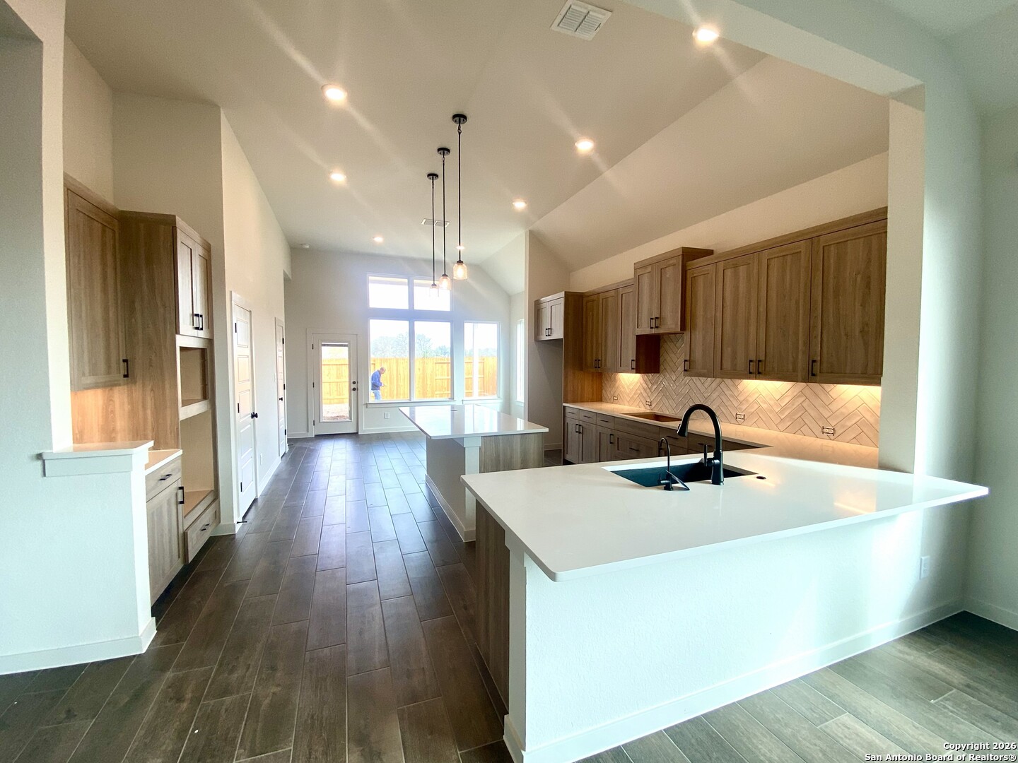 2122 Shepards Street Seguin, TX 78155 - Photo 5 of 28 a kitchen with stainless steel appliances granite countertop a sink a stove and a wooden floors