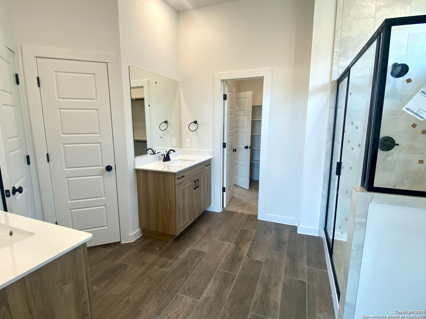 2122 Shepards Street Seguin, TX 78155 - Photo 10 of 28 a view of a bathroom with a sink and mirror