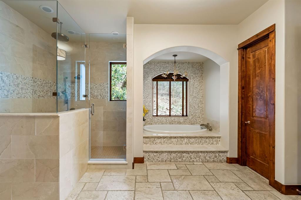9930 Boat Club Road Fort Worth, TX 76179 - Photo 20 of 40 The primary bathroom in the main house includes a walk in shower and a luxury bath tub!