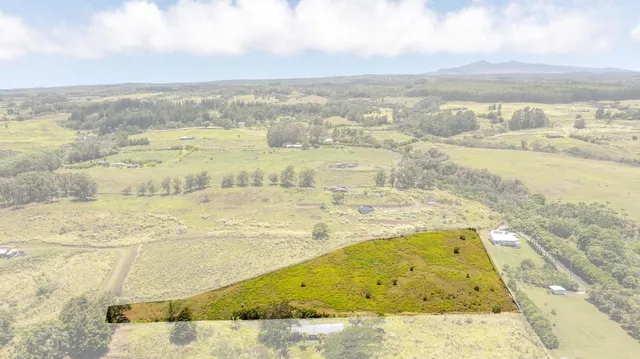 a view of a big yard with an outdoor space and seating