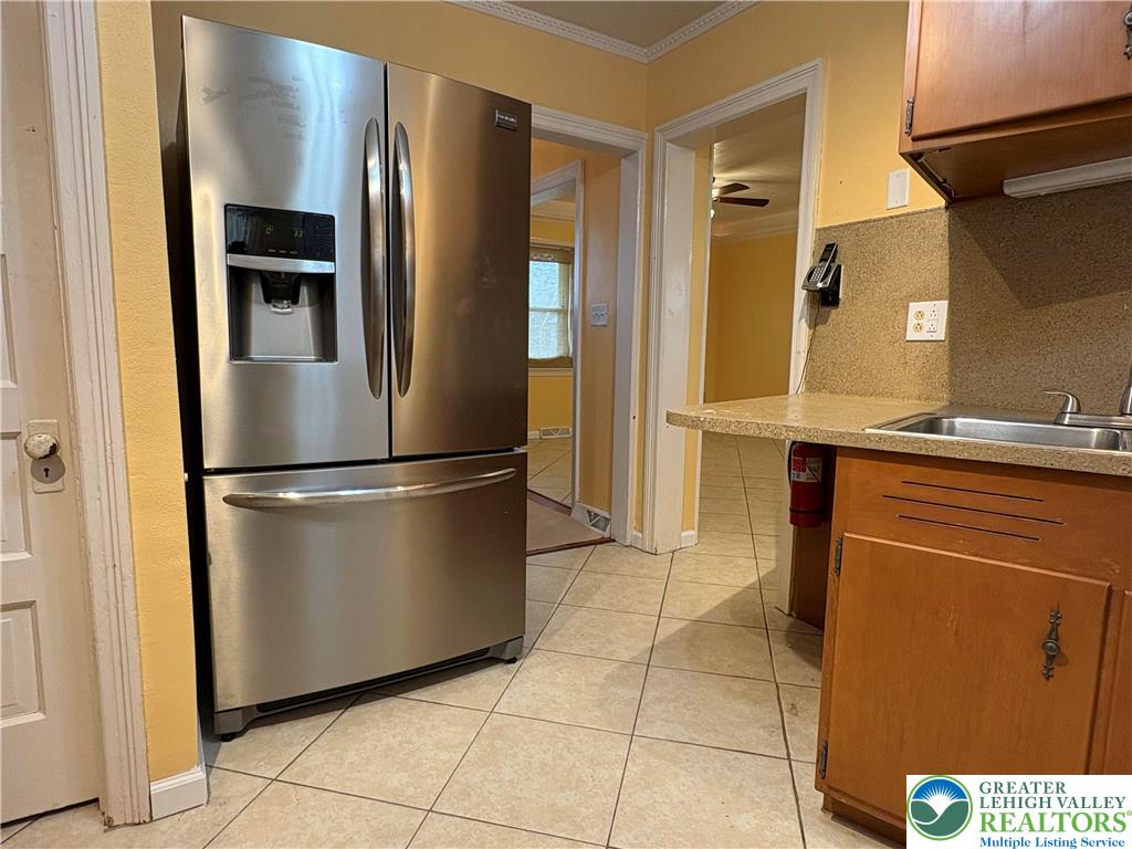 754 East Washington Avenue Bethlehem, PA 18017 - Photo 6 of 19 a kitchen with stainless steel appliances granite countertop a refrigerator and a sink