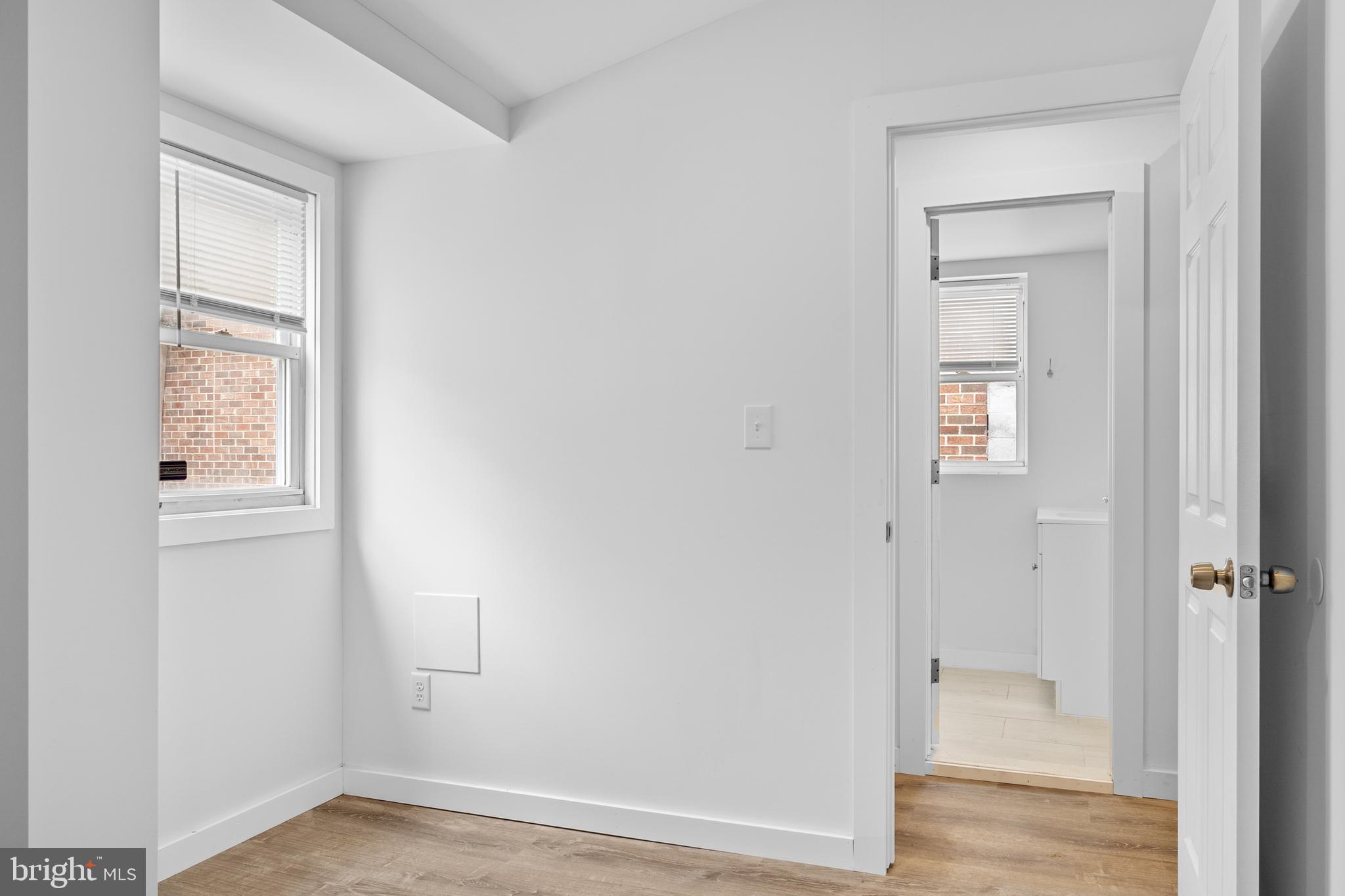 2652 Bridge Street Philadelphia, PA 19137 - Photo 12 of 18 an empty room with wooden floor and a window