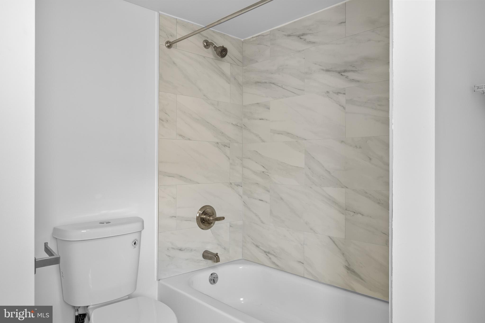 2652 Bridge Street Philadelphia, PA 19137 - Photo 14 of 18 a bathroom with a bathtub and a toilet