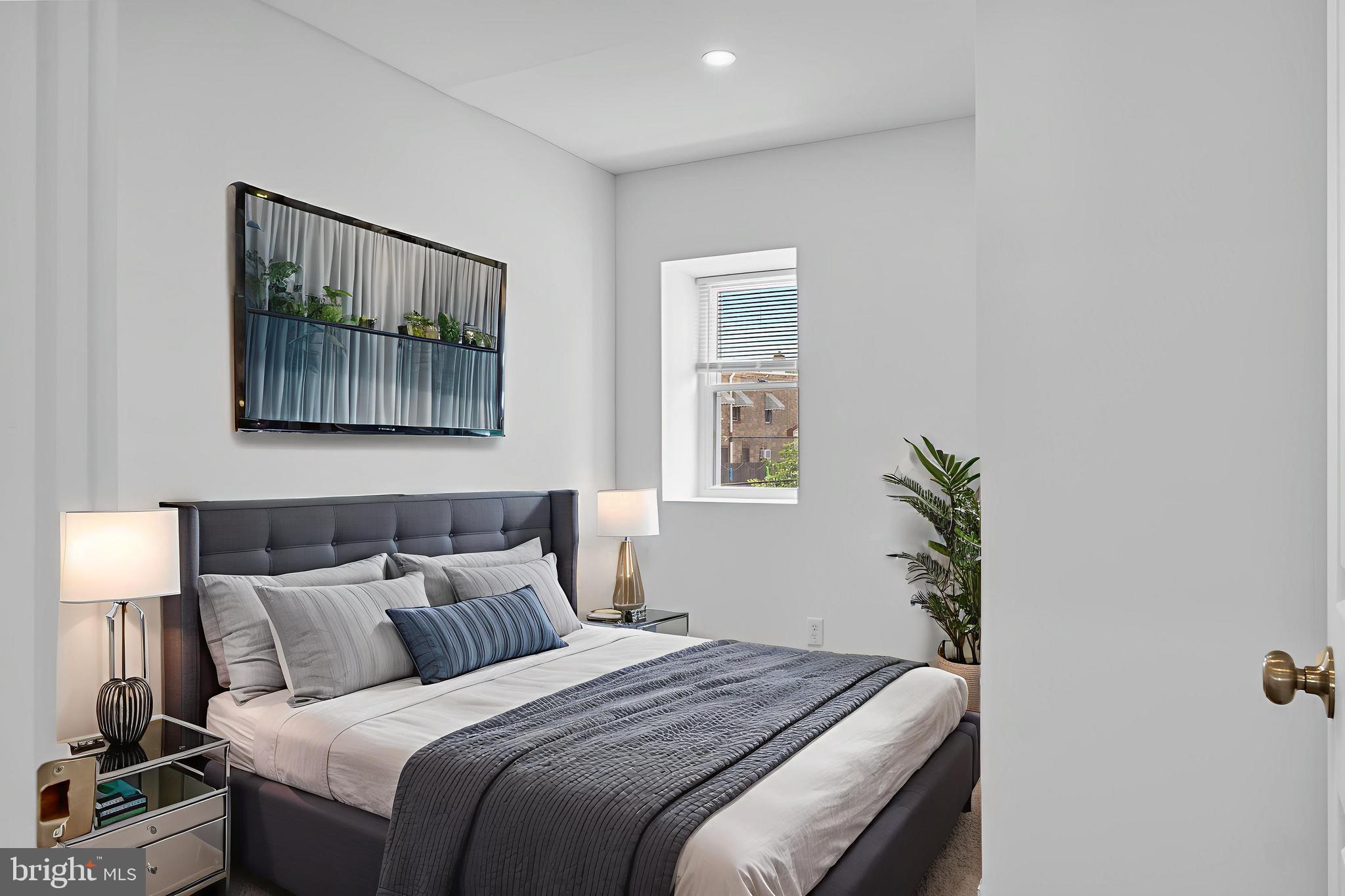 2652 Bridge Street Philadelphia, PA 19137 - Photo 15 of 18 a bedroom with bed and painting on the wall