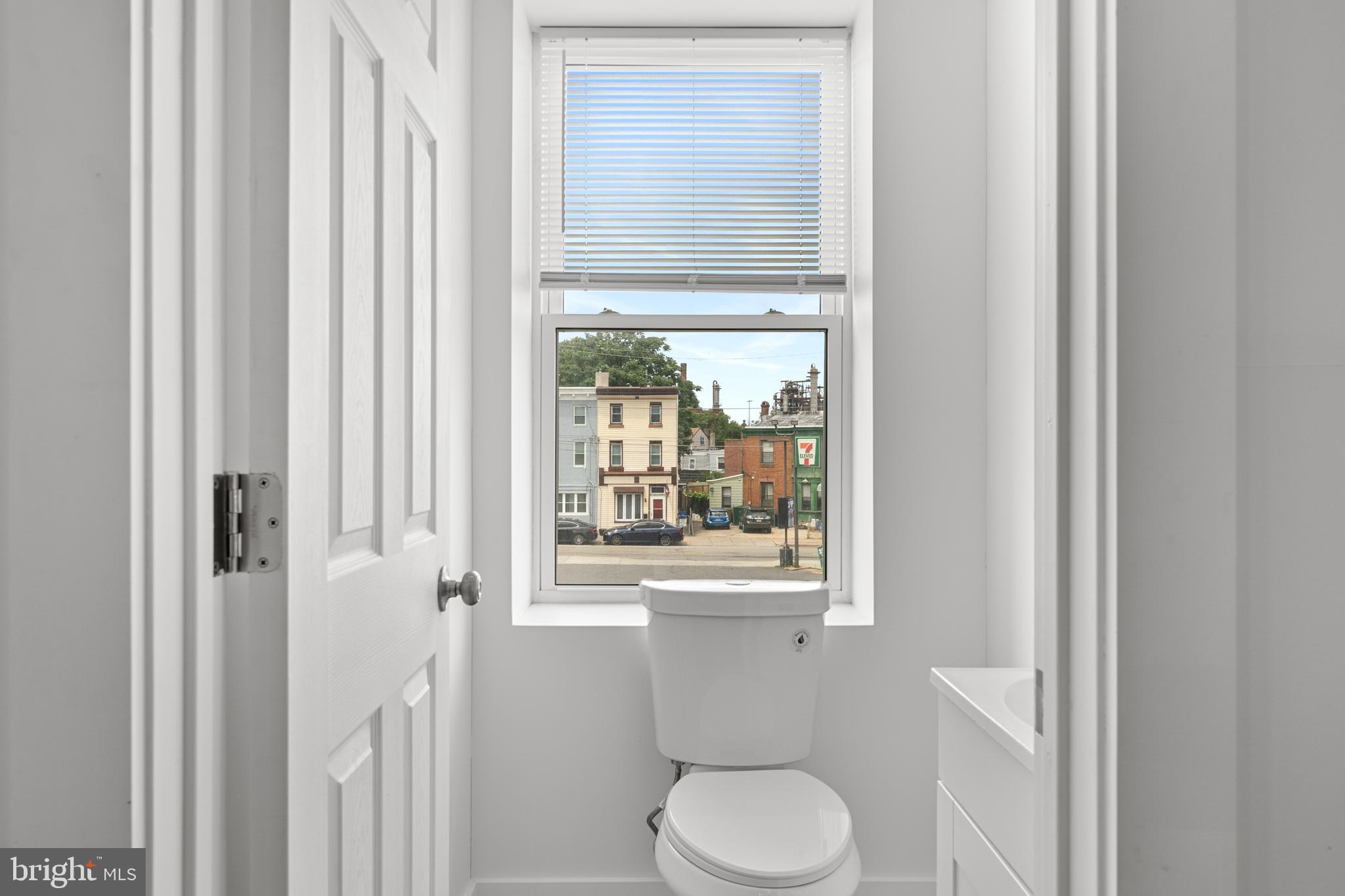 2652 Bridge Street Philadelphia, PA 19137 - Photo 18 of 18 a bathroom with a toilet a sink and a window