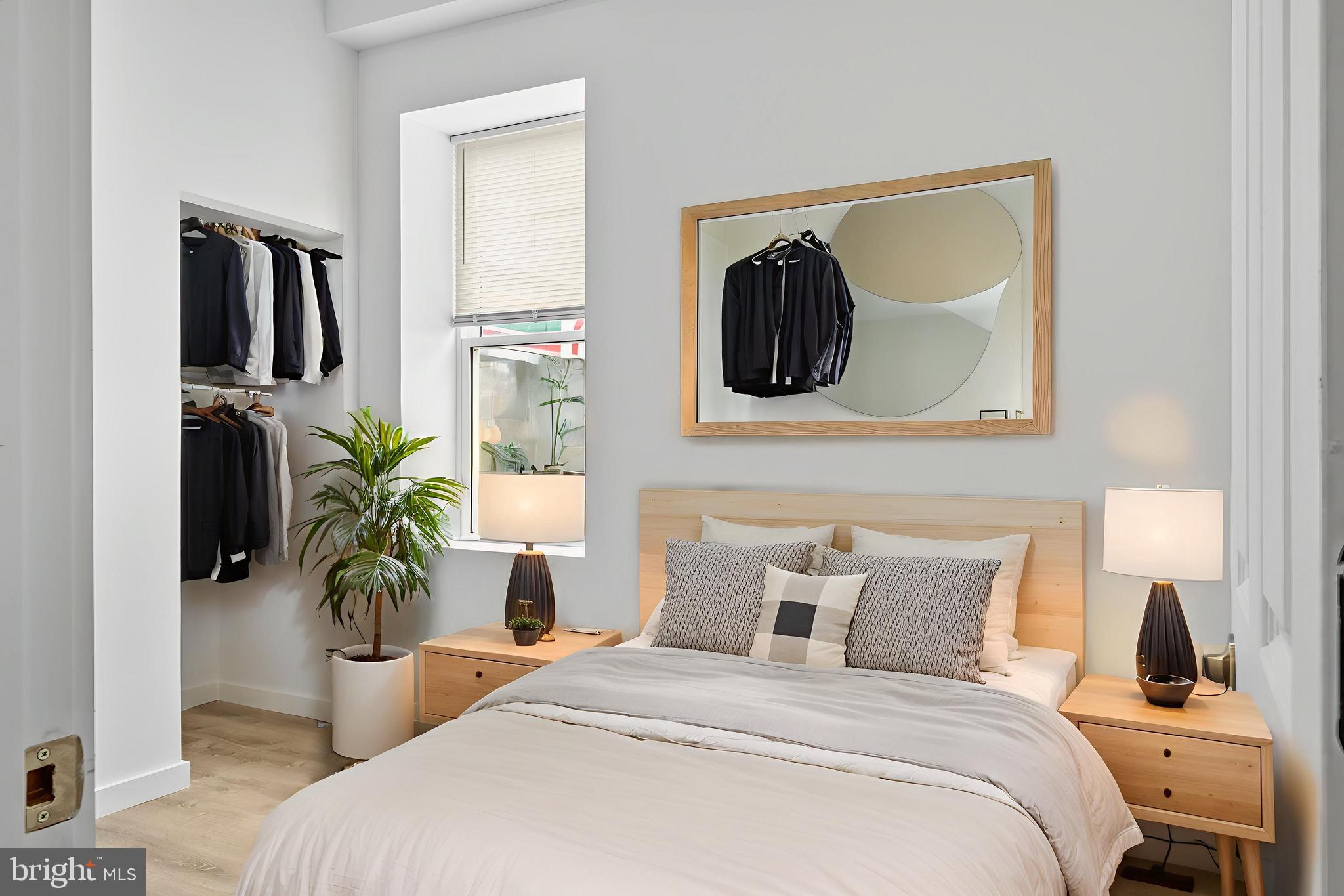 2652 Bridge Street Philadelphia, PA 19137 - Photo 6 of 18 a bedroom with a bed and a potted plant