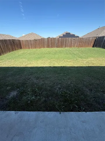 a view of a field with a yard