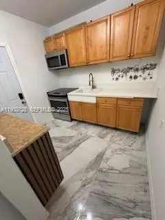 a kitchen with a stove and a sink