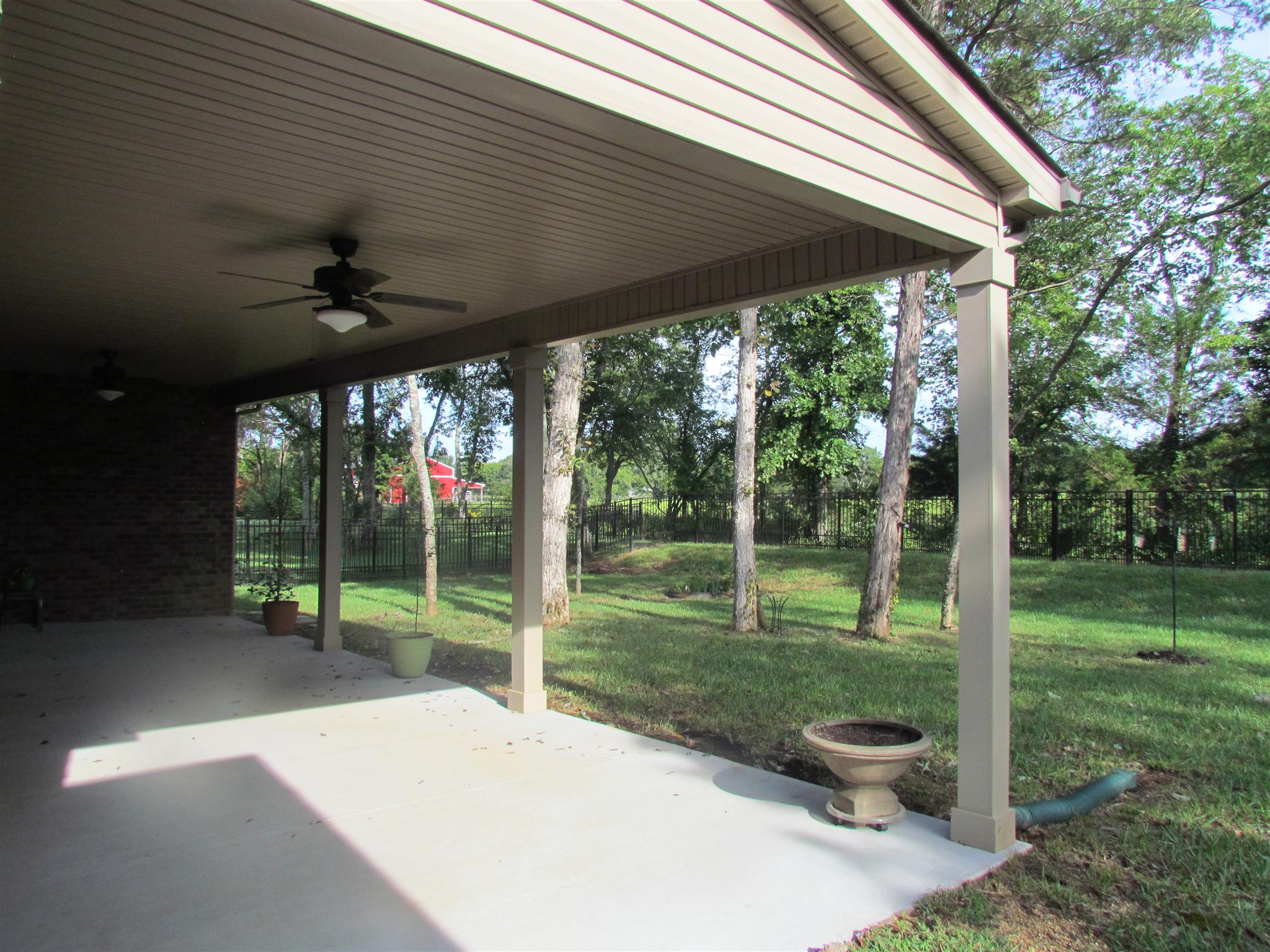 209 Amazonway Ridge Lascassas, TN 37085 - Photo 2 of 27 From the Spacious Outdoor Living Area, you will see only a Farm (no home) behind and black and white cattle grazing around the bright red barn!